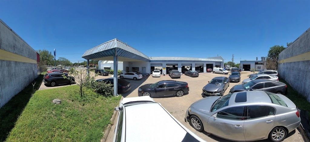The Nova Body Shop lot and service bays on North Lamar