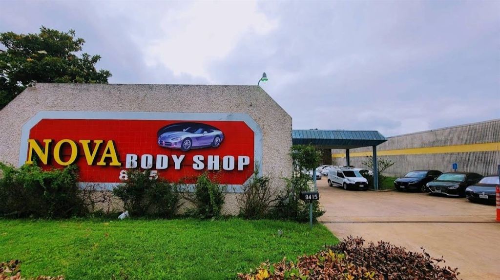 The red and yellow Nova Body Shop sign at 8415 North Lamar Boulevard in Austin