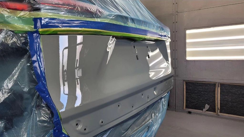 A freshly painted panel in the Nova Body Shop paint booth